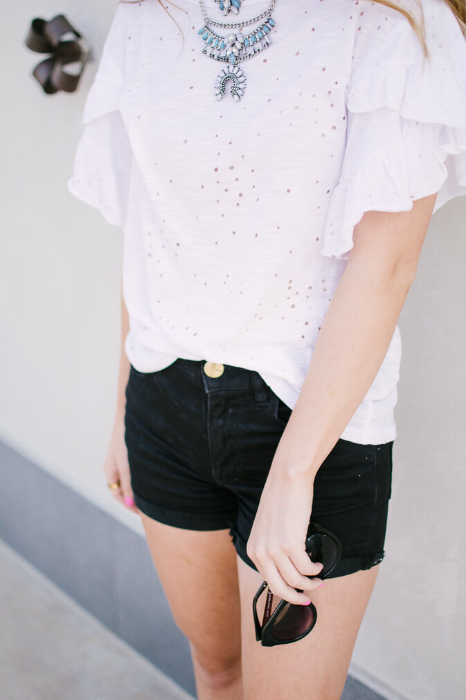 Cutest ruffle distressed tee for under $40 - click through to shop it and everything else you see! I have been on the hunt for a good basic distressed tee and think I have found a keeper. Such a great price point for this distressed tee & perfect to throw on and go | The Blonder Life